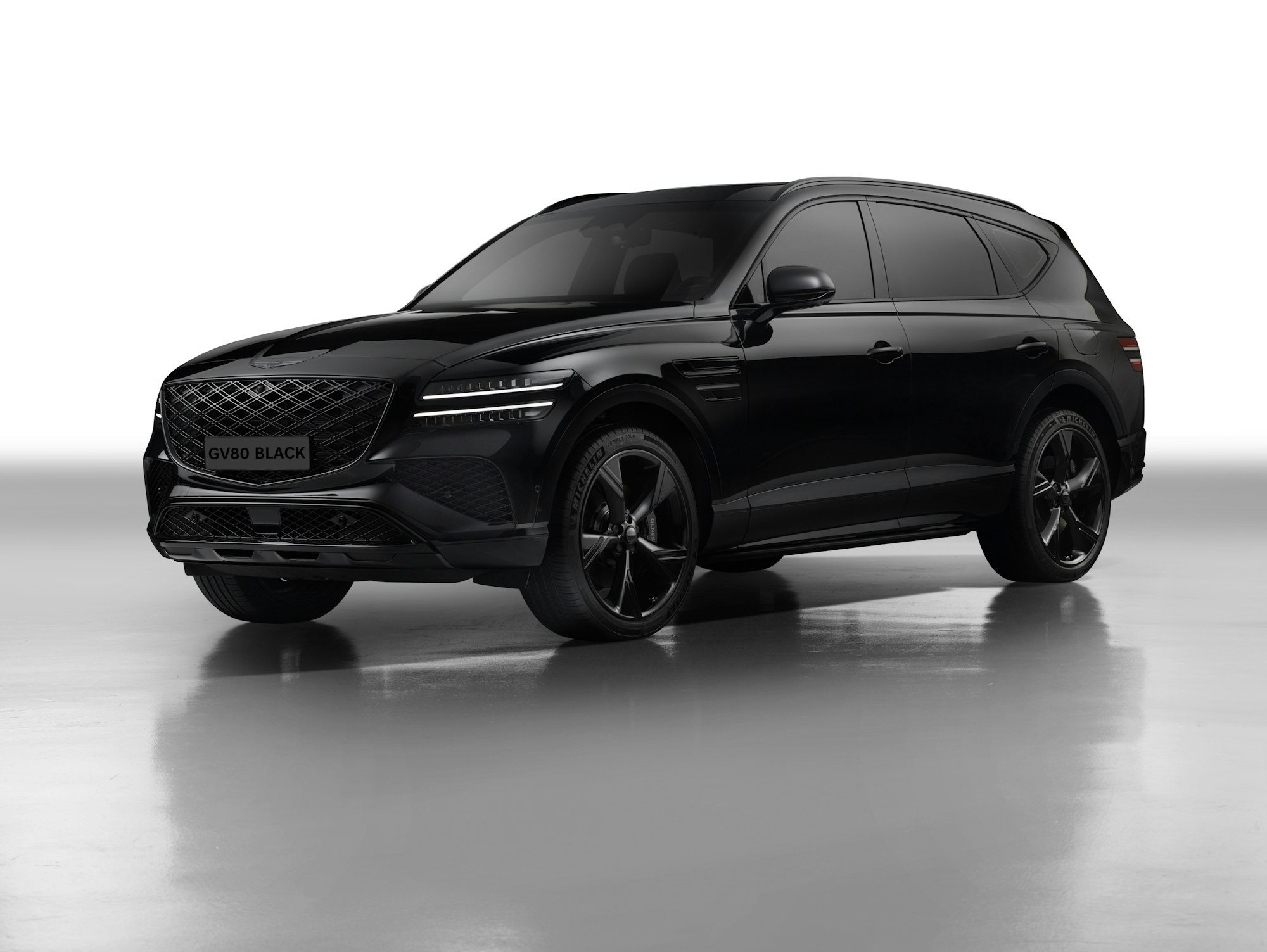A clean black SUV in a white studio
